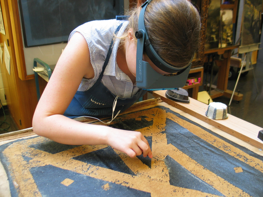 Charlotte removing wrinkled black tape-web